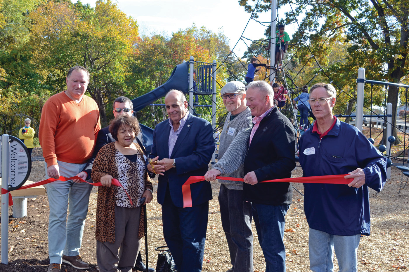 IT'S OFFICIAL: Mayor Joseph Solomon, along with Senator Michael McCaffrey, Ward 8 Councilman Anthony Sinapi, Ward 6 Councilwoman Donna Travis, Friends of Salter Grove Coordinator Peter Becker, Rep. Joseph McNamara and Ward 1 Councilman Richard Corley, snipped the ribbon officially opening the new Salter Grove Park playground. (Warwick Beacon photos)